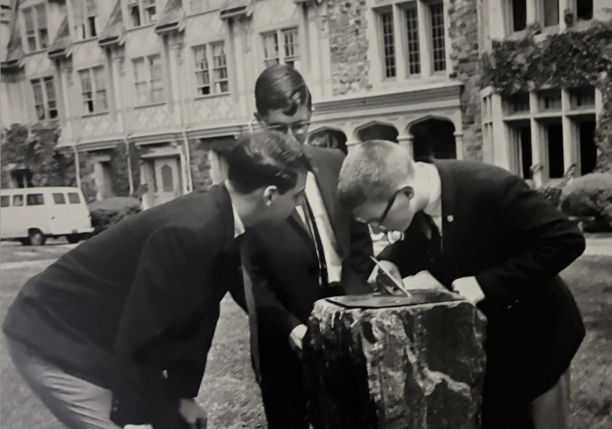 The original Sundial on the quad. It is accompanied by Eric Landman '66, Dan Rutledge, and Alan Stiehl ‘66. The Sundial can now be found in the Hackley archives.